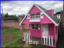 wooden wendy house with upstairs