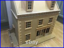 3 STORY WOODEN DOLLS HOUSE pre assembled- not painted
