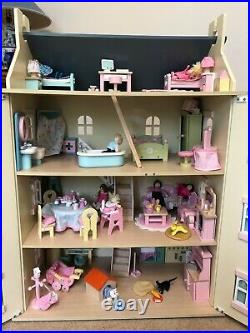 Beautiful Large Wooden Dolls House complete with miniature furniture and people
