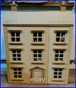 Classic four storey wooden dolls house with all furniture