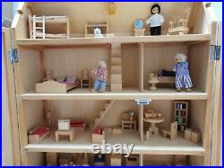 Classic four storey wooden dolls house with all furniture