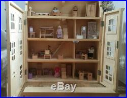 Classic four storey wooden dolls house with all furniture with people