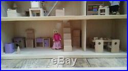 Classic four storey wooden dolls house with all furniture with people