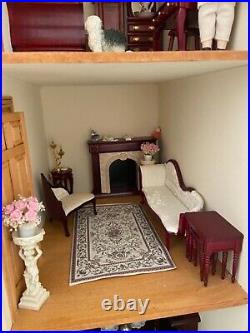 Collectors wooden dolls house with furniture and dolls
