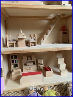 Large Wooden Dolls House With Furniture and Extended Family
