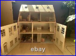 Large wooden dolls house With furniture