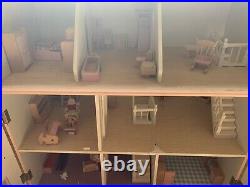 Large wooden dolls house With furniture