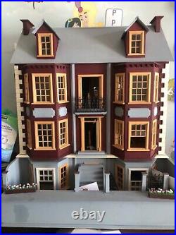 Magnificent and large Wooden dolls house with furniture