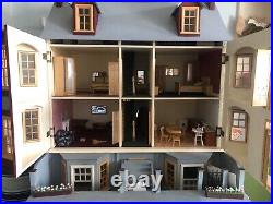 Magnificent and large Wooden dolls house with furniture