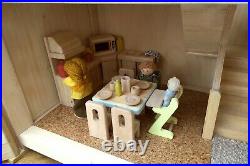 Plan Toys wooden dolls' house with family, furniture and accessories