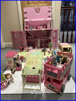 Rosebud Wooden dolls house And Village shops. Full furniture and figures inc Rosebud Wooden dolls house And Village shops. Full furniture and figures inc