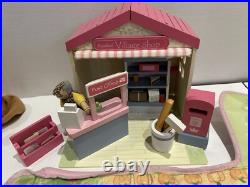 Rosebud Wooden dolls house And Village shops. Full furniture and figures inc Rosebud Wooden dolls house And Village shops. Full furniture and figures inc