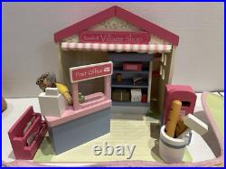 Rosebud Wooden dolls house And Village shops. Full furniture and figures inc Rosebud Wooden dolls house And Village shops. Full furniture and figures inc