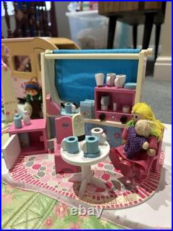 Rosebud Wooden dolls house And Village shops. Full furniture and figures inc Rosebud Wooden dolls house And Village shops. Full furniture and figures inc