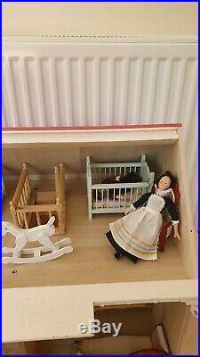 Stunning Vintage Victorian Wooden Dollhouse complete with furniture and 5 dolls