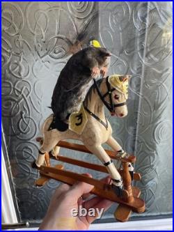 Taxidermy mole displayed on rare antique wooden dolls house horse