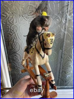 Taxidermy mole displayed on rare antique wooden dolls house horse