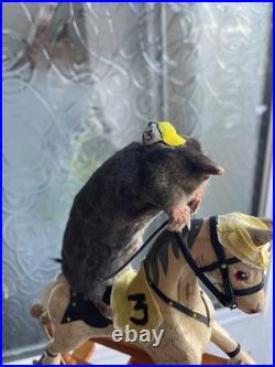 Taxidermy mole displayed on rare antique wooden dolls house horse