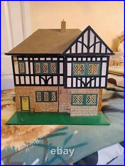 Vintage Tudor style Dolls House with a host of accessories furnished wooden