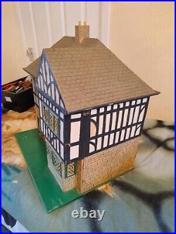 Vintage Tudor style Dolls House with a host of accessories furnished wooden