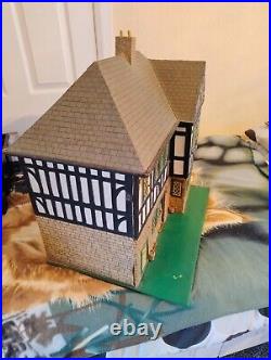 Vintage Tudor style Dolls House with a host of accessories furnished wooden