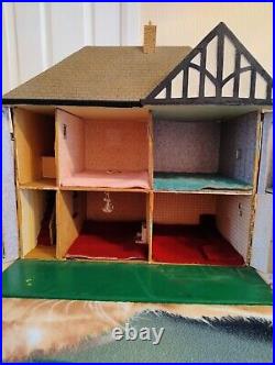 Vintage Tudor style Dolls House with a host of accessories furnished wooden