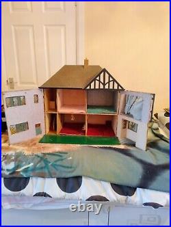 Vintage Tudor style Dolls House with a host of accessories furnished wooden