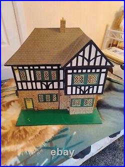 Vintage Tudor style Dolls House with a host of accessories furnished wooden