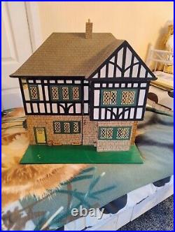 Vintage Tudor style Dolls House with a host of accessories furnished wooden