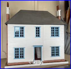 Vintage Wooden Dolls House with wooden cladding Vintage Wooden Dolls House with wooden cladding