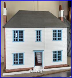 Vintage Wooden Dolls House with wooden cladding Vintage Wooden Dolls House with wooden cladding