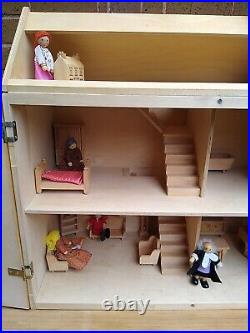 Wooden Dolls House Complete With Dolls And Furniture