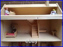 Wooden Dolls House Complete With Dolls And Furniture