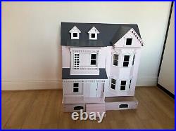 Wooden Dolls House with dolls and furniture