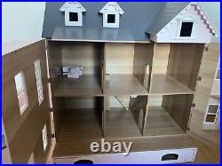 Wooden Dolls House with dolls and furniture