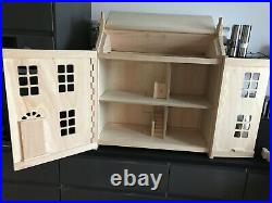 Wooden dolls house Plan toys Brand