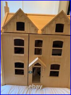 Wooden dolls house and furniture