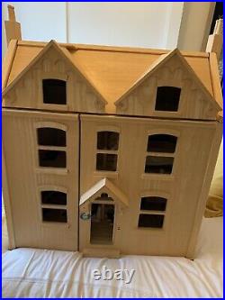 Wooden dolls house and furniture