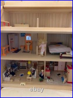 Wooden dolls house and furniture