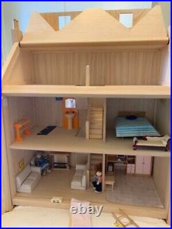 Wooden dolls house and furniture