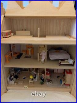 Wooden dolls house and furniture