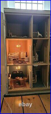 Wooden dolls house and furniture bundle, two working lights