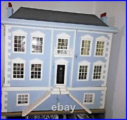 Wooden dolls house and huge amount of furniture. Handmade Very good condition