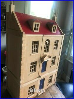 Wooden dolls house and huge amount of furniture. Handmade. Very good condition