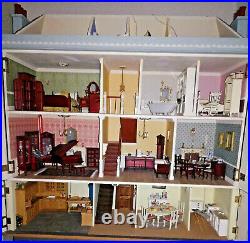 Wooden dolls house and huge amount of furniture. Handmade Very good condition