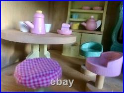 Wooden dolls house and huge amount of furniture. Handmade. Very good condition