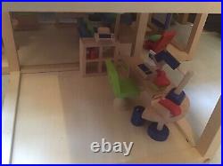 Wooden dolls house early learning centre
