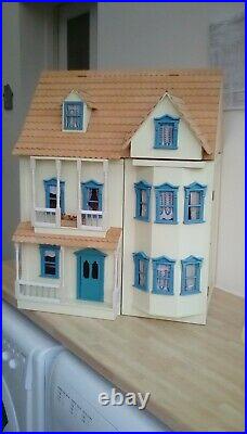 Wooden dolls house in cream and blue 5 or 6 rooms in very good condition
