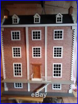 Wooden dolls house with electric lighting