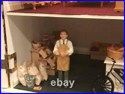 Wooden dolls house with furniture